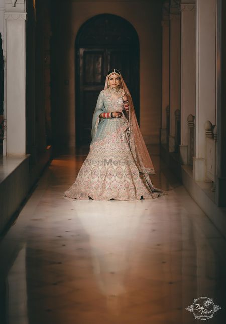 An elegant bride in a beautiful pastel lehenga on her wedding day. 