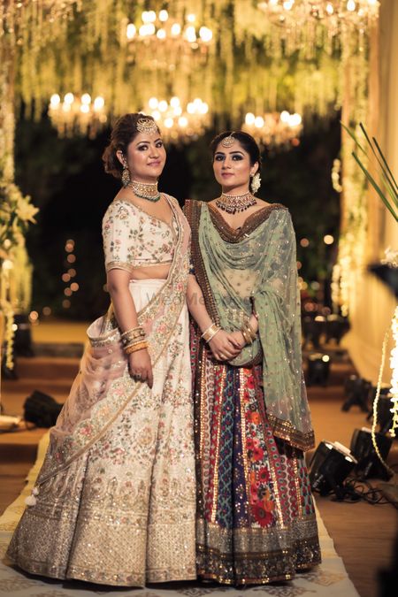 Photo of sister of the bride or bridesmaids in fancy lehengas