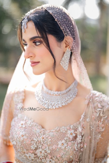 Stunning closeup shot of the bride in gorgeous makeup and lovely diamond jewellery