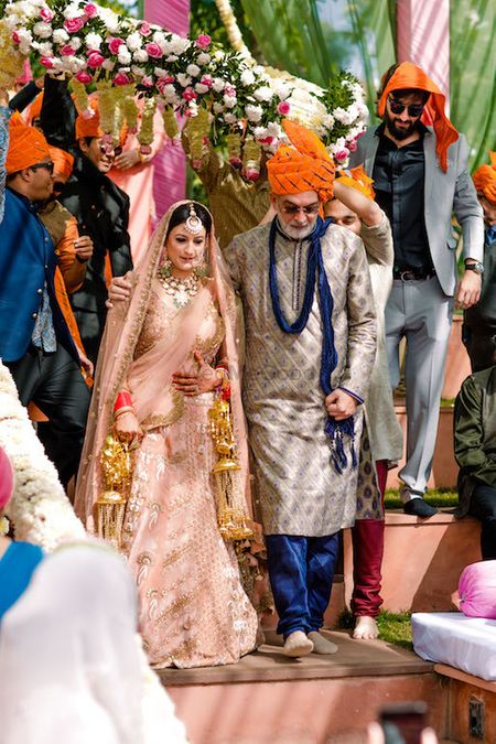 Photo of Bride entering with father under phoolon ki chadar