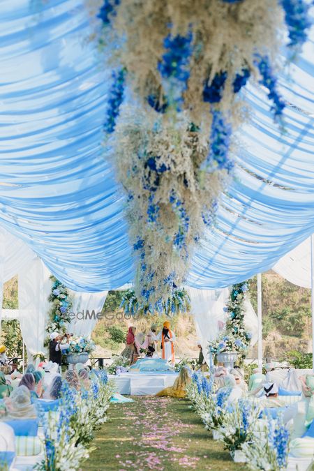 Photo of Beautiful white and blue themed floral decor for an anand karaj ceremony