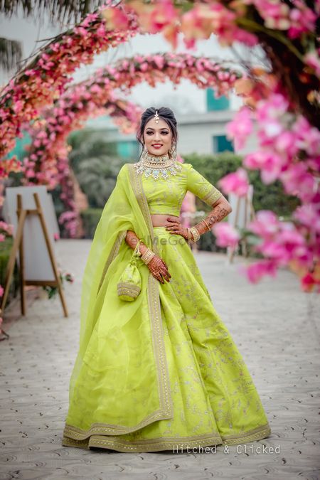 Photo of Mehendi bridal look in lime green lehenga