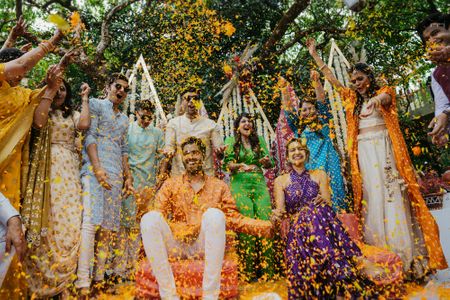A candid capture of a flower shower on their haldi day