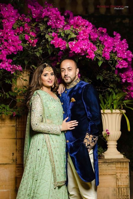 Photo of Sangeet couple shot with bride in pista green lehenga