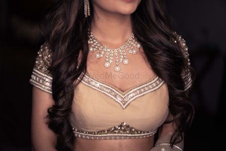 bridal blouse with pearl and diamond necklace