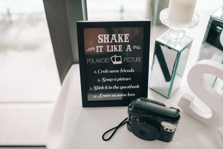 Photo booth idea: keep polaroid camera and let guests click a picture for your guestbook