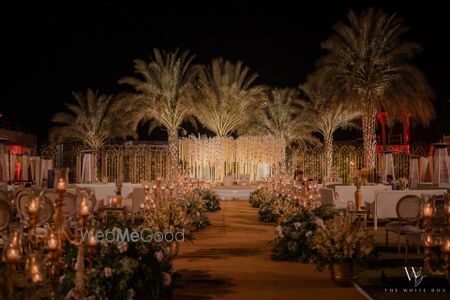 Photo of Gorgeous floral decor for this night wedding with candles and floral elements