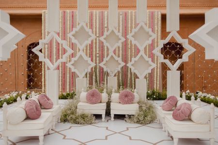 Gorgeous light pink and white decor set up in a pastel theme for an outdoor event
