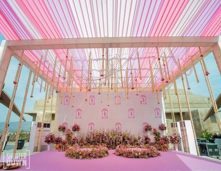 Pink themed floral decor for an outdoor haldi 