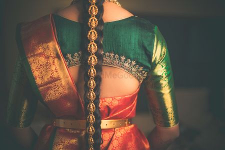 South Indian bridal hairstyle and blouse back shot 