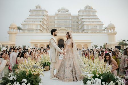 Photo of Stunning floral decor for the garland exchange stage against a royal backdrop