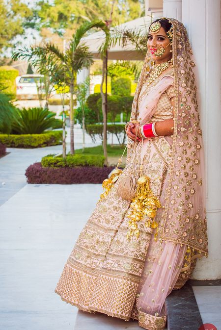 Sikh Bride in Pastel Pink and Gold Lehenga and Jewelry