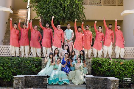 bride and groom with their bridesmaids and groomsmen on the mehendi 