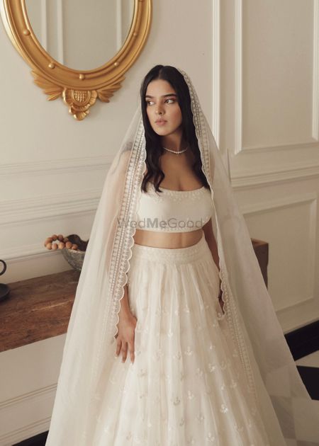 Photo of Bride in a white lehenga for her engagement