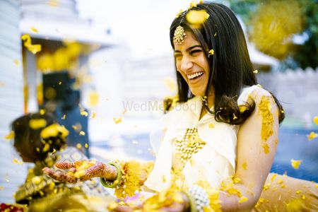 Photo of Happy and bright bridal shot on haldi.