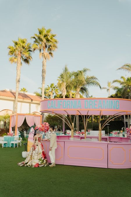 Photo of Unique pink and blue bar set up for a mehendi brunch in an outdoor venue