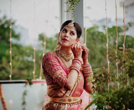 South Indian bride in a pink saree