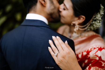 Bride and groom shot with engagement ring in focus