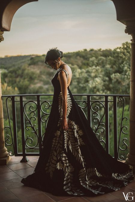 Bride wearing a black and silver manish malhotra gown for her cocktail