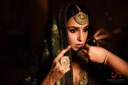 Photo of Beautiful shot of the bride getting ready for Anand Karaj
