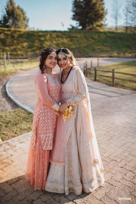Pastel bride with sister 