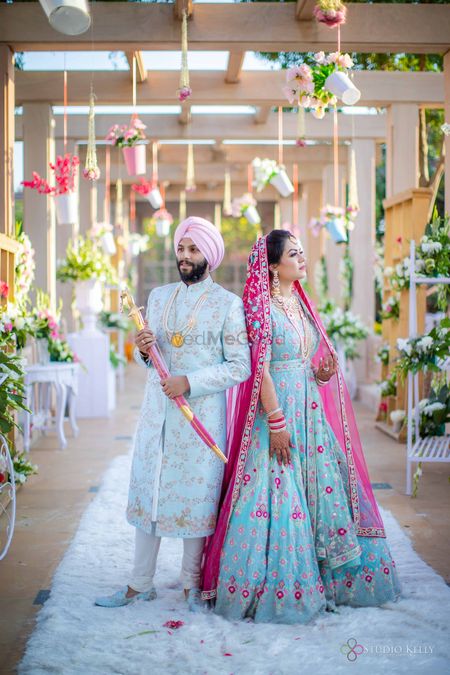 sikh couple shot with both of them in powder blue outfits