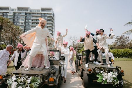 Groom entering the wedding with his baraatis dancing 