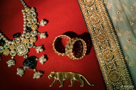Bridal getting ready shot idea with accessories and Sabyasachi logo