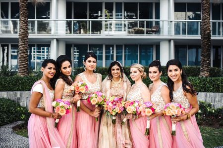 Bride with bridesmaids holding bouquets 