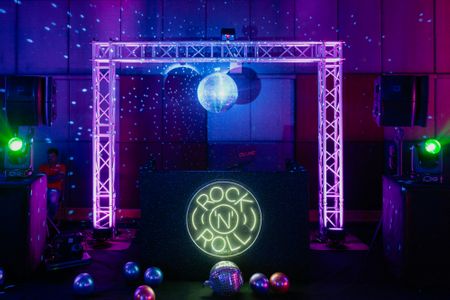 Disco themed sangeet and cocktail night decor with rock and roll lighting ideas