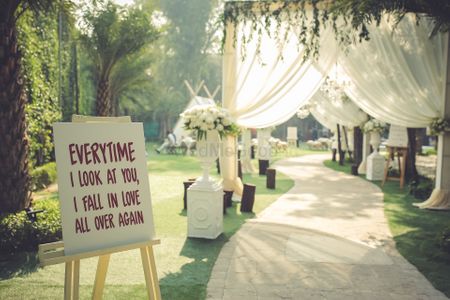Simple yet stunning drape entrance decor with a signage