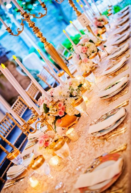 Photo of blush pink and gold table setting
