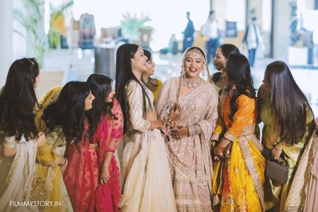Photo of Bride with bridesmaids caught in a candid moment