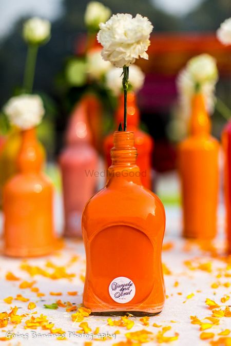 Photo of handpainted bottles as table center pieces