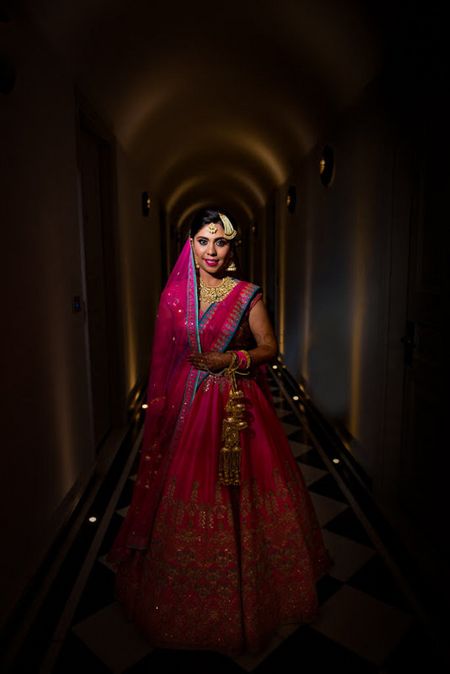 Indian bride wearing hot pink lehenga for wedding 