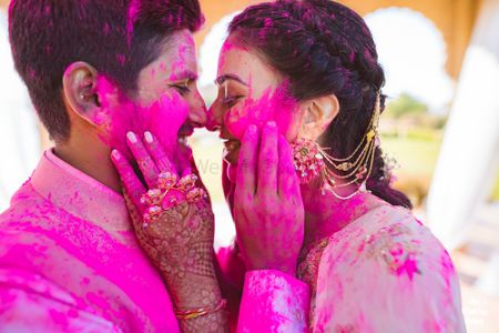 Photo of A couple captured on camera during their holi-mehendi party