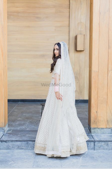 Photo of Offbeat bride in white with open hair