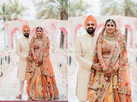 Photo of matching sikh bride and groom in orange outfits