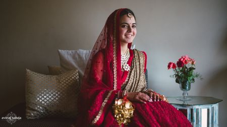 Photo of red and gold bridal lehenga