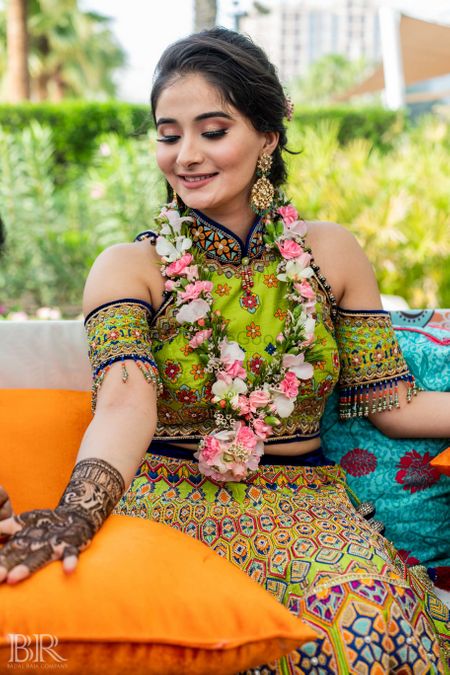 Mehendi outfit with green cold shoulder blouse 