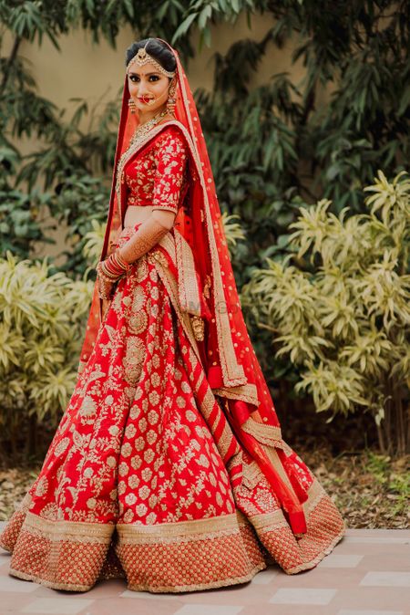 Red and gold bridal sabysachi lehenga with embroidery 