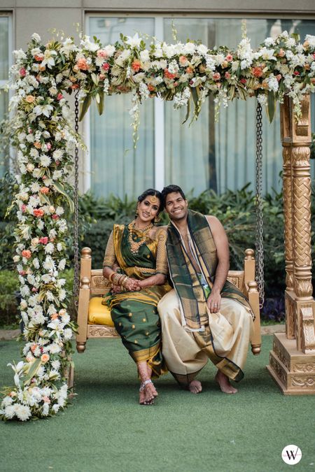 South Indian couple poses on a swing