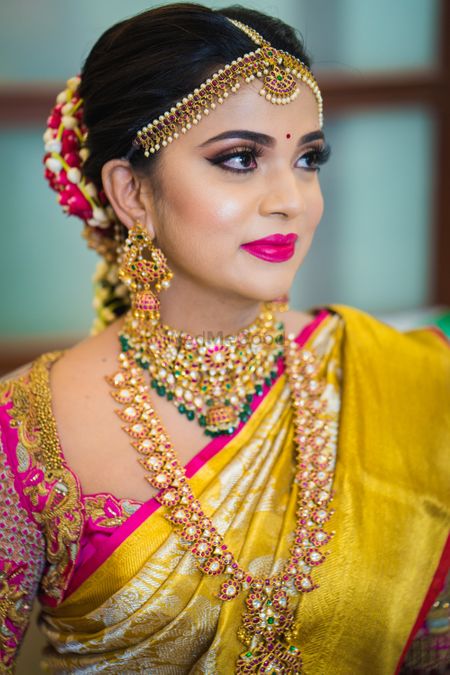 South indian bride with layered jewellery
