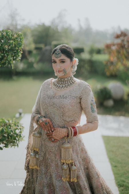 Gorgeous bridal portrait in a pastel lehenga and statement diamond jewellery with emerald detailing