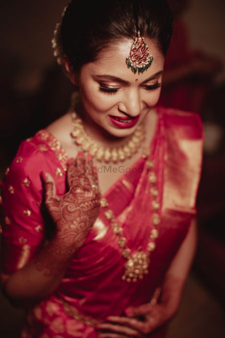 Close up shot of a South Indian bride getting ready for her wedding day.