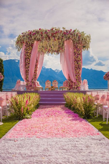 Floral mandap decor with petal aisle