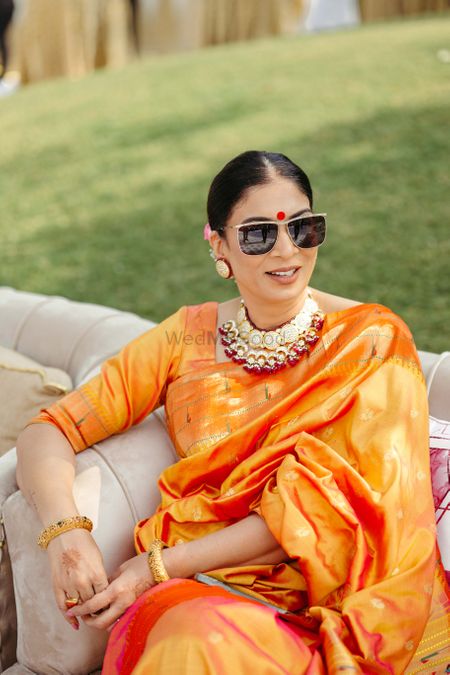 mother of the bride in an orange saree