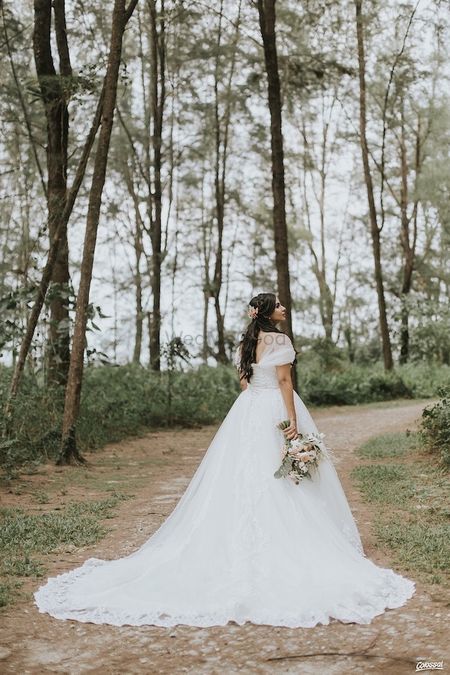 Pretty bride wearing white gown for Christian wedding 