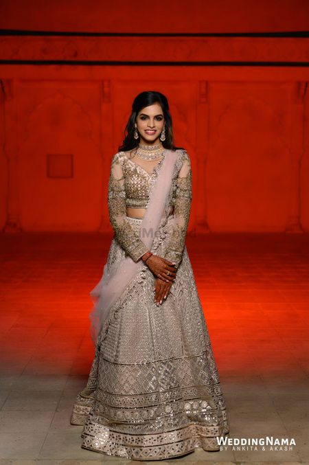 Photo of blush pink and gold sangeet lehenga with full sleeved blouse