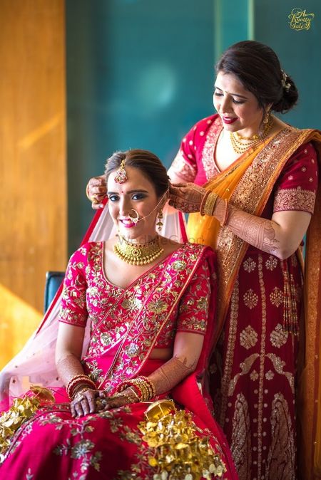 Photo of Bride getting ready shot with her mother